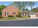 Traditional brick home with attached garage, manicured lawn, and classic curb appeal at 1817 Bedfordshire Dr, Decatur, GA 30033