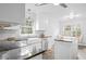 Modern kitchen with stainless steel appliances, white cabinetry, and an island at 1817 Bedfordshire Dr, Decatur, GA 30033