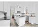 Newly renovated kitchen with white cabinets, stainless appliances, and center island at 1817 Bedfordshire Dr, Decatur, GA 30033