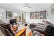 Inviting living room with built-in bookshelves, comfortable seating, and neutral color palette at 1817 Bedfordshire Dr, Decatur, GA 30033