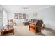 Bright living room featuring carpet, couch, ceiling fan, and built-in bookshelves at 1817 Bedfordshire Dr, Decatur, GA 30033
