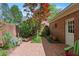 Charming brick patio with lush greenery and a brick wall, creating a private outdoor space at 1817 Bedfordshire Dr, Decatur, GA 30033