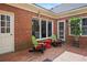 Cozy brick patio with colorful chairs, offering a relaxing outdoor seating area at 1817 Bedfordshire Dr, Decatur, GA 30033