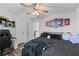 Bedroom boasts modern decor, bed, and a ceiling fan for added comfort at 235 South St, Buford, GA 30518