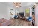 Open-concept living area featuring hardwood floors, natural light, and seamless connection to the kitchen at 235 South St, Buford, GA 30518
