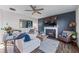 Cozy living room with a fireplace, comfortable seating, and plenty of natural light at 235 South St, Buford, GA 30518