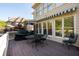 Back deck featuring a grill and an outdoor dining set, perfect for entertaining at 2553 Twilight Vw, Snellville, GA 30078