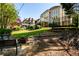 Beautiful backyard with a fire pit, trampoline, and lush green lawn perfect for outdoor activities and relaxation at 2553 Twilight Vw, Snellville, GA 30078