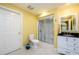 Bright bathroom with a shower, toilet, and vanity with black countertops at 2553 Twilight Vw, Snellville, GA 30078