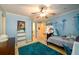 Bedroom featuring blue walls, ceiling fan, blue rug, and a desk with computer on it at 2553 Twilight Vw, Snellville, GA 30078