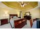 Bedroom featuring neutral carpet, tray ceiling, matching furniture set, and a ceiling fan at 2553 Twilight Vw, Snellville, GA 30078