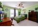 Bedroom with a window, green walls, beige carpet, and wooden dresser at 2553 Twilight Vw, Snellville, GA 30078