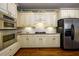 Well-equipped kitchen with stainless steel appliances, custom cabinets and granite countertops at 2553 Twilight Vw, Snellville, GA 30078