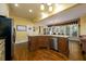 Open kitchen with a large island, stainless steel appliances and beautiful hardwood floors at 2553 Twilight Vw, Snellville, GA 30078