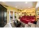 A cozy living room features a red couch and french doors leading to an outside patio at 2553 Twilight Vw, Snellville, GA 30078