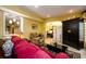 A cozy living room features a red couch and a large black armoire at 2553 Twilight Vw, Snellville, GA 30078