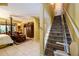 Open living room adjacent to stairwell with chairlift and tile flooring at 2553 Twilight Vw, Snellville, GA 30078