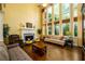 Spacious living room boasts high ceilings, large windows, fireplace and hardwood flooring at 2553 Twilight Vw, Snellville, GA 30078
