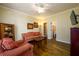 Cozy sitting room with hardwood floors, comfortable seating, and a view into an adjacent bathroom at 2553 Twilight Vw, Snellville, GA 30078