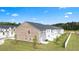 Aerial view of the backyard and homes featuring a fence at 310 Silver Moon Drive # 111, Loganville, GA 30052