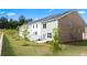 Townhome backyards featuring fenced yard, lawns and trees at 310 Silver Moon Drive # 111, Loganville, GA 30052