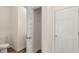 Half bathroom with tile flooring and a storage closet beside the entry door at 310 Silver Moon Drive # 111, Loganville, GA 30052