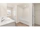 Bathroom features a tub and shower combo with white subway tile and a double sink vanity at 310 Silver Moon Drive # 111, Loganville, GA 30052