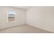 Bedroom with neutral carpet and a window providing natural light at 310 Silver Moon Drive # 111, Loganville, GA 30052