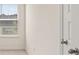 Bedroom featuring a window with blind and white trim at 310 Silver Moon Drive # 111, Loganville, GA 30052