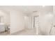 Upstairs hallway with a view into the bathroom and multiple bedrooms at 310 Silver Moon Drive # 111, Loganville, GA 30052