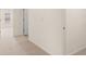 Carpeted hallway showcases the home's layout and neutral color palette at 310 Silver Moon Drive # 111, Loganville, GA 30052