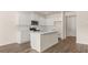 Bright kitchen with a functional island, stainless appliances and ample cabinet space at 310 Silver Moon Drive # 111, Loganville, GA 30052