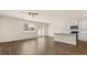 Spacious living room that flows into kitchen; features hardwood floors and stainless steel appliances at 310 Silver Moon Drive # 111, Loganville, GA 30052