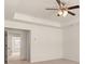 Bright main bedroom with a tray ceiling and a doorway to the adjoining bathroom at 310 Silver Moon Drive # 111, Loganville, GA 30052