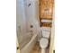 Bathroom with a bathtub, tiled floor, cabinet, and modern fixtures at 999 Grassdale Rd, Cartersville, GA 30121