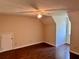 A bedroom featuring hardwood floors, a ceiling fan, and neutral-colored walls at 999 Grassdale Rd, Cartersville, GA 30121