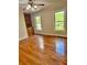 Bright bedroom with hardwood floors, built-in shelving, and natural light at 999 Grassdale Rd, Cartersville, GA 30121