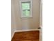Cozy bedroom featuring hardwood floors and a window overlooking the outdoors at 999 Grassdale Rd, Cartersville, GA 30121