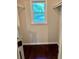 A walk-in closet featuring hardwood floors and a window at 999 Grassdale Rd, Cartersville, GA 30121