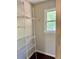 A closet featuring wire shelving, hardwood floors, and a window at 999 Grassdale Rd, Cartersville, GA 30121