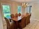 Dining room with chandelier is naturally lit from two windows at 999 Grassdale Rd, Cartersville, GA 30121