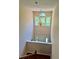 Bright foyer with high ceilings, chandelier, and clerestory window illuminating the front door below at 999 Grassdale Rd, Cartersville, GA 30121