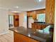 Spacious kitchen with granite countertops, oak cabinets and tiled flooring at 999 Grassdale Rd, Cartersville, GA 30121