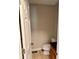 Powder room with tiled floors and a toilet at 999 Grassdale Rd, Cartersville, GA 30121
