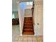Wooden staircase and tile landing at 999 Grassdale Rd, Cartersville, GA 30121