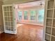 Bright sunroom with hardwood floors and many windows at 999 Grassdale Rd, Cartersville, GA 30121