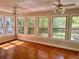 Sunroom with walls of windows offering abundant natural light at 999 Grassdale Rd, Cartersville, GA 30121