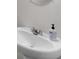 Close-up of a pristine white bathroom sink with a modern faucet and stylish soap dispenser at 1929 Millstream Holw, Conyers, GA 30012