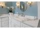 Bathroom featuring marble countertops, custom cabinetry, and stylish fixtures at 22 The Prado Ne, Atlanta, GA 30309