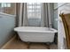 Clawfoot tub in bathroom with a window and neutral decor at 22 The Prado Ne, Atlanta, GA 30309